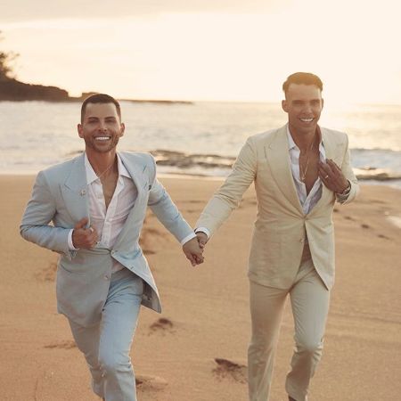 GT Dave and his wife Allan Fanuchii holding hand and runing in beach.
